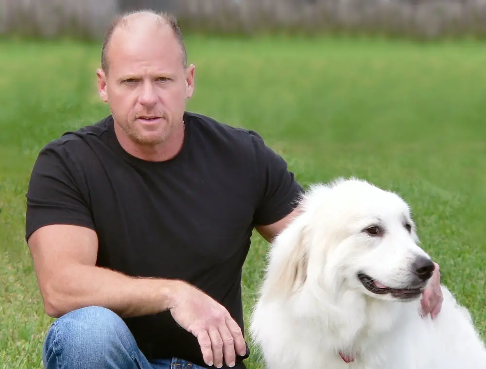 Great Pyrenees with trainer -  White dogs breeds